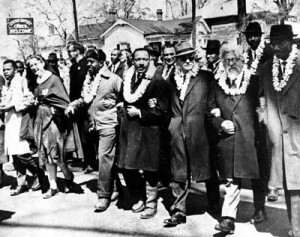 Abraham Joshua Heschel & Dr Martin Luther King Jr link arms in 1965 Selma march