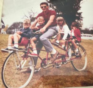 1960s Jerry with 4 of his 5 children on very long tandem