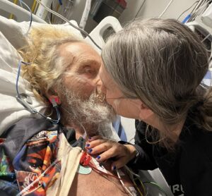 Nadine kissing Jerry in hospital bed