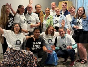 Family sporting special tee-shirts surround Jerry
